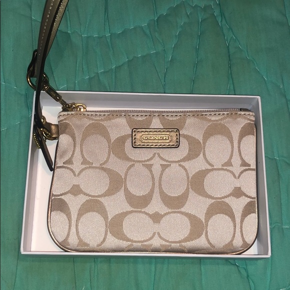 Coach Handbags - New never used Coach signature tan zip wristlet